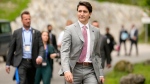 Prime Minister Justin Trudeau walks to a media conference near the G7 venue at Castle Elmau in Kruen, Germany, on June 28, 2022. (Markus Schreiber / AP) 