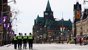 Police officers patrol downtown Ottawa on Sunday, May 1, 2022. (Sean Kilpatrick / THE CANADIAN PRESS)