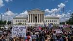 Abortion-rights protesters demonstrate outside the Supreme Court in Washington on June 25, 2022. The Supreme Court has ended constitutional protections for abortion that had been in place nearly 50 years, a decision by its conservative majority to overturn the court&