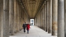 People walk through a colonade in the Museums Island in Berlin, Germany, on Oct. 21, 2020. (Markus Schreiber / AP)