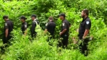 Montreal police officers comb a wooded area near the Charles de Gaulle Bridge in the search of evidence linked to the homicide of 15-year-old Meriem Boundaoui. (CTV News)