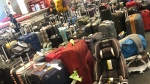 A photo of luggage piled up at Pearson International Airport over the weekend. (Jehaanara Kurji/Twitter photo)