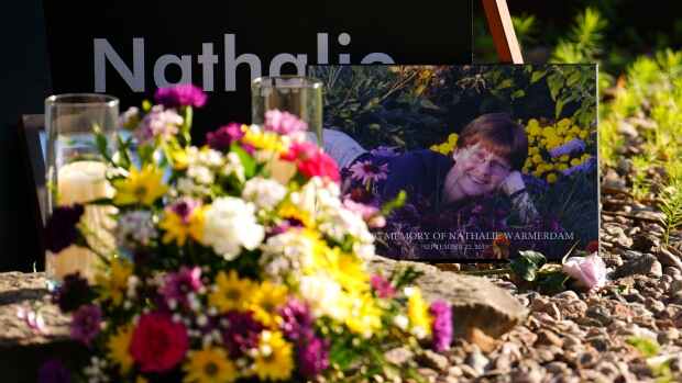 A pictures of murder victim Nathalie Warmerdam, is displayed during a vigil at the Women's Monument in Petawawa, Ont., following the juries release of recommendations in the Borutski Inquest in Pembroke, Ont., on Tuesday, June 28, 2022. The inquest, which began June 6, examined the circumstances surrounding the deaths of Carol Culleton, Nathalie Warmerdam and Anastasia Kuzyk, with a focus on the dynamics of gender-based violence, intimate partner violence and femicide in rural communities. The three women were murdered by Basil Borutski in 2015 who was a man who had a known history of violence against women. (Sean Kilpatrick/THE CANADIAN PRESS)