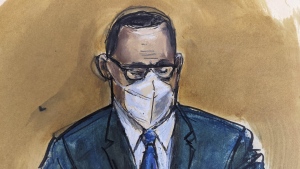 In this courtroom sketch, R. Kelly listens as the jury foreperson reads the verdict, Sept. 27, 2021, in New York. (AP Photo/Elizabeth Williams)
