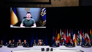 Ukraine's President Volodymyr Zelenskyy addresses leaders via a video screen during a round table meeting at a NATO summit in Madrid, on June 29, 2022. (Manu Fernandez / AP) 