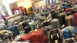 A photo of luggage piled up at Pearson International Airport over the weekend