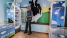FILE - In this Tuesday, July 20, 2021 file photo, an Israeli shops at the Ben & Jerry's ice-cream factory in the Be'er Tuvia Industrial area, southern Israel. (AP Photo/Tsafrir Abayov, File)