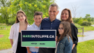 Mark Sutcliffe (centre) and his family--wife Ginny, and kids Erica(left), Jack and Kate--at Sutcliffe's announcement that he is running for mayor of Ottawa. June 29, 2022. (Tyler Fleming/CTV News Ottawa)
