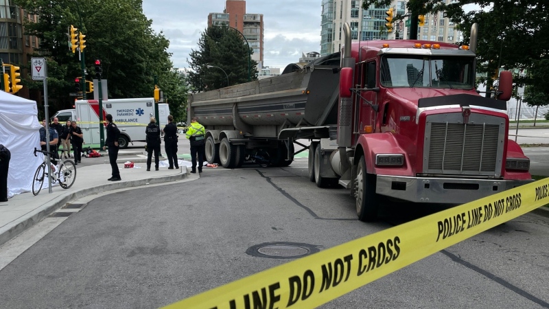 Police investigate a fatal crash between a semi-truck and cyclist in downtown Vancouver on June 29, 2022. 