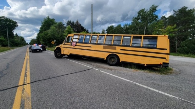 A school bus that ended up in a ditch in Caledon, Ont. is seen in this image. (Twitter/OPP Central Region)