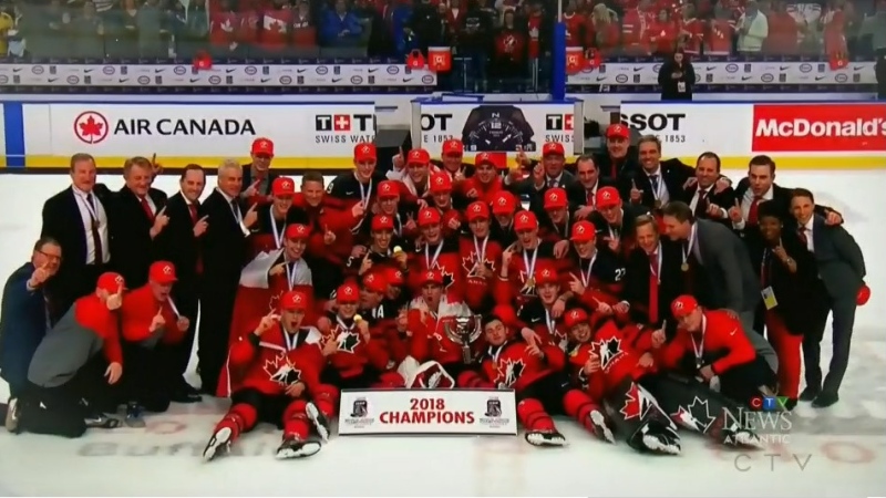 Team Canada celebrates their championship victory in 2018.