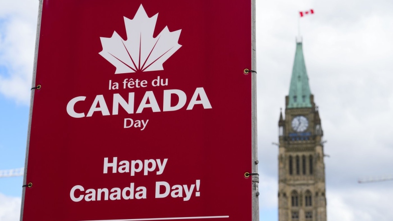 Signs are pictured on Parliament Hill prior to Canada Day in Ottawa, June 27, 2022. THE CANADIAN PRESS/Sean Kilpatrick