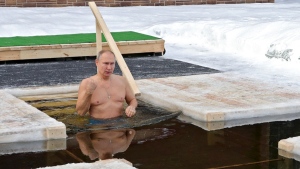 Russian President Vladimir Putin bathing in icy water during a traditional Epiphany celebration outside Moscow, Russia, on Jan. 19, 2021. (Mikhail Klimentyev, Sputnik, Kremlin Pool Photo via AP) 