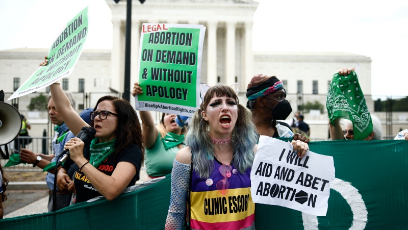 Abortion rights supporters demonstrate outside the U.S. Supreme Court in Washington, DC, on June 24. The Supreme Court's decision to overturn Roe v. Wade has raised fears that it could have "far-reaching ramifications" on people looking to get pregnant and the clinics providing services to help them. (Samuel Corum/Bloomberg/Getty Images)