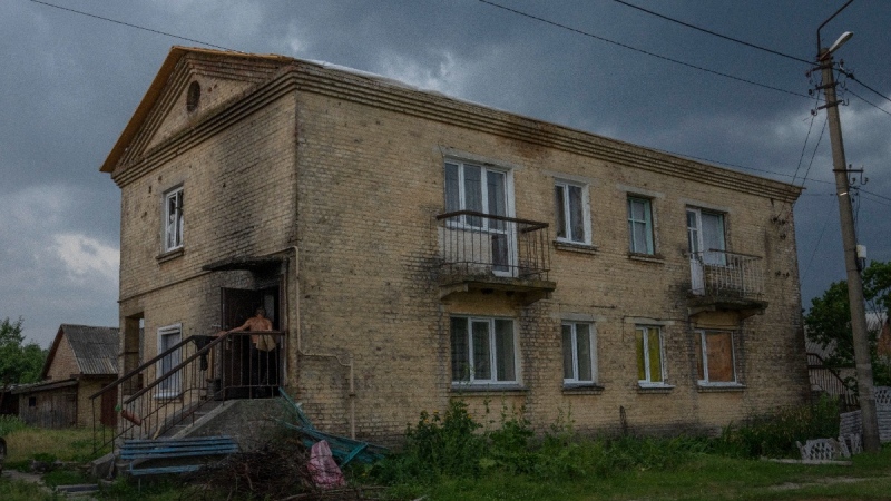 A man walks into his home damaged by Russian strikes, in Yahidne village, northern Chernihiv region, Ukraine, on June 29, 2022. (Nariman El-Mofty / AP) 