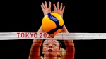 United States' Jordyn Poulter blocks the ball during the women's volleyball preliminary round at the 2020 Summer Olympics, on July 27, 2021. (Frank Augstein / AP) 