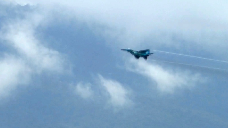 In this image taken from video, a fighter jet flies overhead and visible from Tak province, Thailand on Thursday, June 30, 2022. A Myanmar fighter jet crossed the border into Thailand's airspace, prompting Thai air force jets to scramble and officials to order the evacuation of villages and classrooms, officials said. (AP Photo/Chiravut Rungjumrusrussamee)