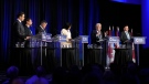 Conservative leadership hopeful Jean Charest, second right, speaks as Pierre Poilievre, left to right, Patrick Brown, Scott Aitchison, Leslyn Lewis, and Roman Baber look on during the Conservative Party of Canada French-language leadership debate in Laval, Quebec on Wednesday, May 25, 2022. THE CANADIAN PRESS/Ryan Remiorz
