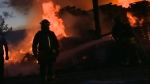 An undated file image of a Winnipeg firefighter battling a blaze in 2015. (Source: CTV News Winnipeg)