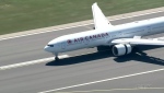 An Air Canada flight lands on an airport runway.