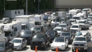 Vehicles are seen lined up at the Horseshoe Bay ferry terminal on June 30, 2022 after multiple sailings were cancelled.