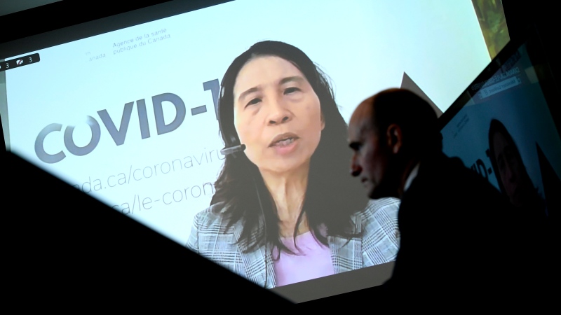 Chief Public Health Officer of Canada Dr. Theresa Tam is seen via videoconference as Minister of Health Jean-Yves Duclos looks on during a news conference on the COVID-19 pandemic and the omicron variant, in Ottawa, on Friday, Jan. 7, 2022. THE CANADIAN PRESS/Justin Tang 