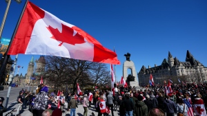 Participants gather at the National War Memorial during a demonstration, part of a convoy-style protest participants are calling "Rolling Thunder", in Ottawa, Saturday, April 30, 2022. THE CANADIAN PRESS/Sean Kilpatrick