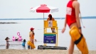 Lifeguards work at Brittany Beach of the Ottawa River in Ottawa, June 24, 2022. Municipalities across Canada are grappling with lifeguard shortages as city pools and beaches open for the summer. THE CANADIAN PRESS/Sean Kilpatrick