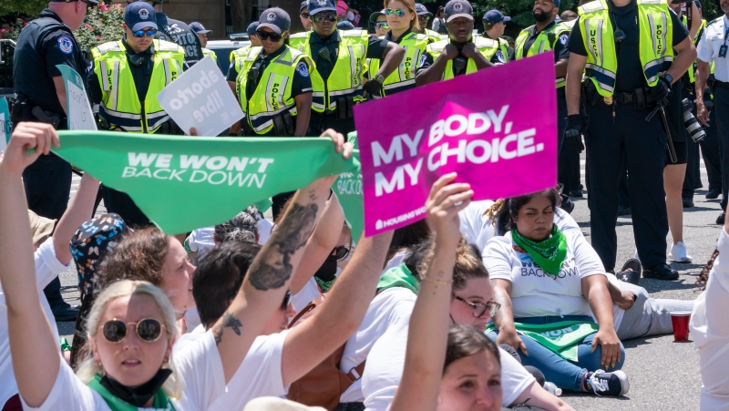 Abortion-rights activists demonstrating against the Supreme Court decision to overturn Roe v. Wade sit in an act of civil disobedience, Thursday, June 30, 2022, in Washington. (AP Photo/J. Scott Applewhite)