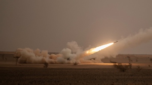 A launch truck fires the High Mobility Artillery Rocket System (HIMARS) at its intended target during the African Lion military exercise in Grier Labouihi complex, southern Morocco, June 9, 2021. (AP Photo/Mosa'ab Elshamy)