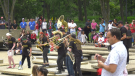 People participate in a Canada Day celebration at the Alberta Legislature grounds on July 1, 2022 (CTV News Edmonton/Jessica Robb).