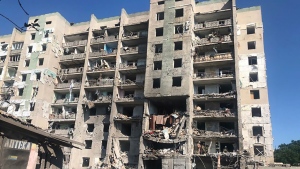 In this photo provided by the Odesa Regional Prosecutor's Office, a damaged residential building is seen in Odesa, Ukraine, early Friday, July 1, 2022, following Russian missile attacks. Ukrainian authorities said Russian missile attacks on residential buildings in the port city of Odesa have killed more than a dozen people. (Ukrainian Emergency Service via AP)