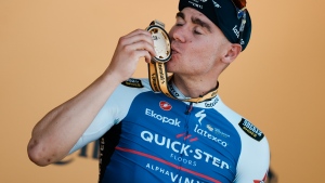 Stage winner Netherlands' Fabio Jakobsen celebrates on the podium after the second stage of the Tour de France cycling race over 202.5 kilometres (125.8 miles) with start in Roskilde and finish in Nyborg, Denmark, Saturday, July 2, 2022. (AP Photo/Thibault Camus)