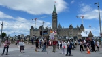 A small group of protesters outside Parliament Hill on Saturday. (Josh Pringle/CTV News Ottawa)
