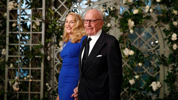 FILE - Jerry Hall and Rupert Murdoch arrive for a State Dinner with French President Emmanuel Macron and then-U.S. President Donald Trump at the White House, Tuesday, April 24, 2018, in Washington. (AP Photo/Alex Brandon)