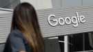 A woman walks below a Google sign on the campus in Mountain View, Calif., on Sept. 24, 2019. More than 40 Democratic members of Congress are asking Google to stop what they see as the unnecessary collection and retention of peoples' location data. They're concerned it could be used to identify women seeking abortions. (AP Photo/Jeff Chiu, File)