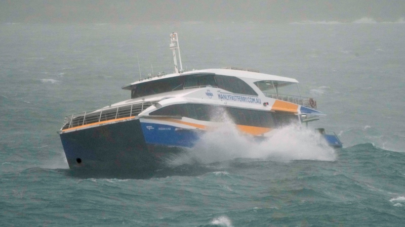 The Manly Ferry makes its way through heavy swells across Sydney Harbour, Australia on July 3, 2022. A severe weather warning for heavy rainfall and strong winds has been issued for Sydney, as parts of NSW have received more than their monthly average rainfall within hours this weekend. (AP Photo/Mark Baker)