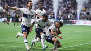 Vancouver Whitecaps' Russell Teibert, front left to right, Pedro Vite, Andres Cubas and Cristian Dajome, back, celebrate Cubas' goal against Los Angeles FC during the second half of an MLS soccer game in Vancouver, on Saturday, July 2, 2022. THE CANADIAN PRESS/Darryl Dyck