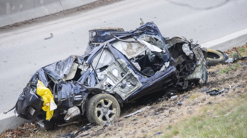 The wreckage of a car is shown in Montreal, Friday, December 17, 2021. THE CANADIAN PRESS/Graham Hughes