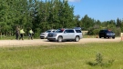RCMP officers at the scene of a hit and run on Highway 60 south of Highway 627 on Sunday July 3 2022. (CTV News Edmonton)