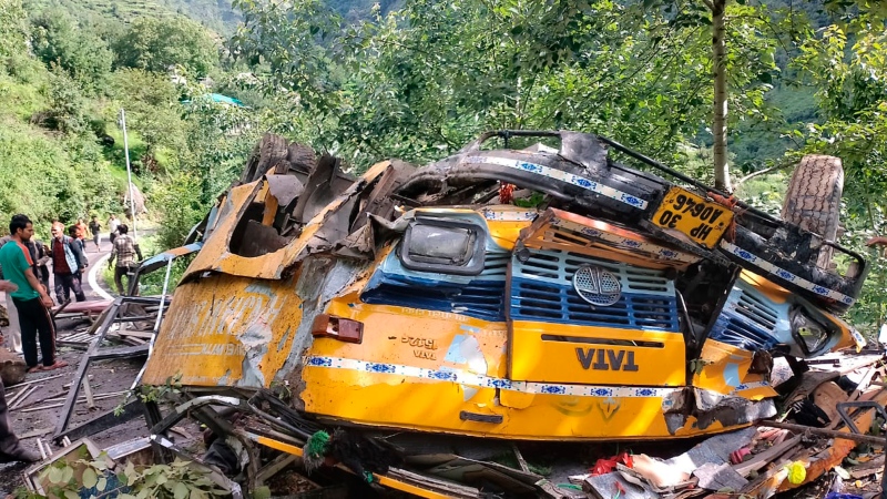This photograph provided by Deputy Commissioner's office, Kullu, shows the wreckage of a passenger that bus slid off a mountain road and fell into a deep gorge near Kullu, Himachal Pradesh state, India, July 4, 2022. (Deputy Commissioner's office, Kullu via AP)