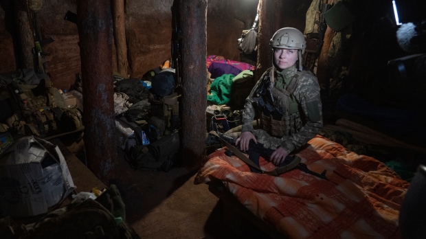Ukrainian platoon commander Mariia rests in a trench in a position in the Donetsk region, Ukraine, July 2, 2022. (AP Photo/Efrem Lukatsky)