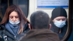 People wearing face masks to help protect against the spread of coronavirus ride a a subway car in St. Petersburg, Russia, Jan. 21, 2022. (AP Photo/Dmitri Lovetsky)
