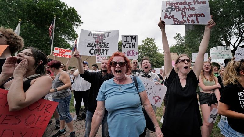 People rally in support of abortion rights, Saturday, July 2, 2022, at a park in Kansas City, Mo. (AP Photo/Charlie Riedel)
