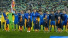 Ukraine players line up before the UEFA Nations League soccer match between Ukraine and Northern Ireland, in Lodz, Poland, Tuesday, June 14, 2022. (AP Photo/Piotr Hawalej)