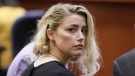 Actor Amber Heard waits before the verdict was read at the Fairfax County Circuit Courthouse in Fairfax, Va, Wednesday, June 1, 2022. (Evelyn Hockstein/Pool via AP)