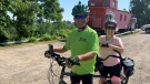 Friends from St. Thomas, Ont. Mike Rousseau and Amber Needham are cycling 2,500 km on a tandem bike to raise money for a stem cell donor registry, July 4, 2022. (Brent Lale/CTV News London)