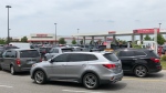 Drivers line up for gas at the Costco gas bar in Windsor, Ont., on Monday, July 7, 2022. (Gary Archibald/CTV News Windsor) 