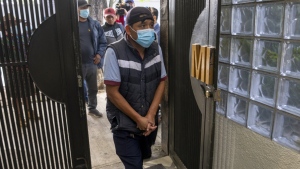 Mynor Cardona, Yenifer Yulisa Cardona Tomás's father, enters the Foreign Ministry for a meeting with authorities to find out about the fate of his daughter, in Guatemala City, June 30, 2022. (AP Photo/Moises Castillo)