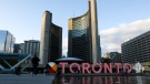 The Toronto sign in Nathan Phillips Square is illuminated orange to commemorate National Day for Truth and Reconciliation in Toronto on Thursday, September 30, 2021. THE CANADIAN PRESS/Evan Buhler